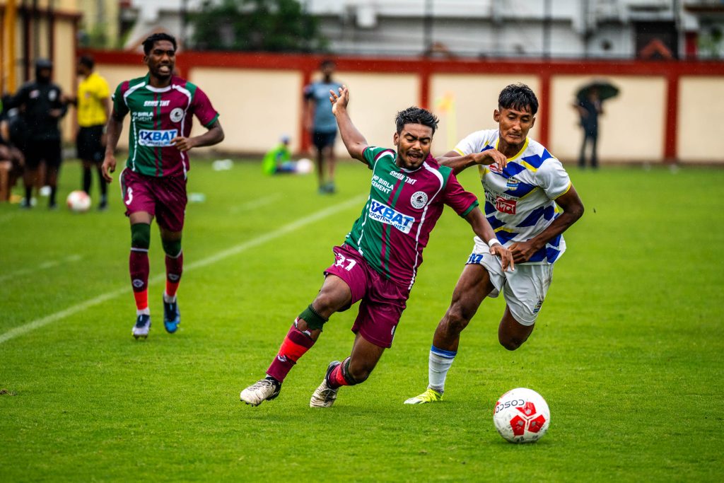 Fardin Ali Molla of Mohun Bagan tackled