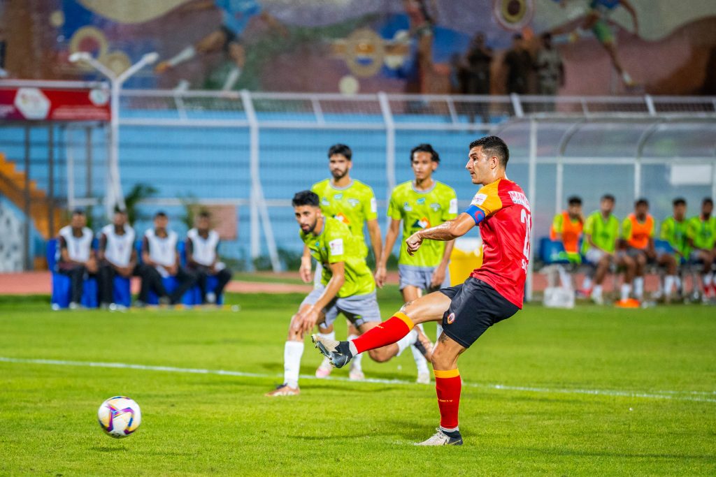 Saul Crespo of Emami East Bengal taking penalty against Downtown Heroes in Durand Cup 2024