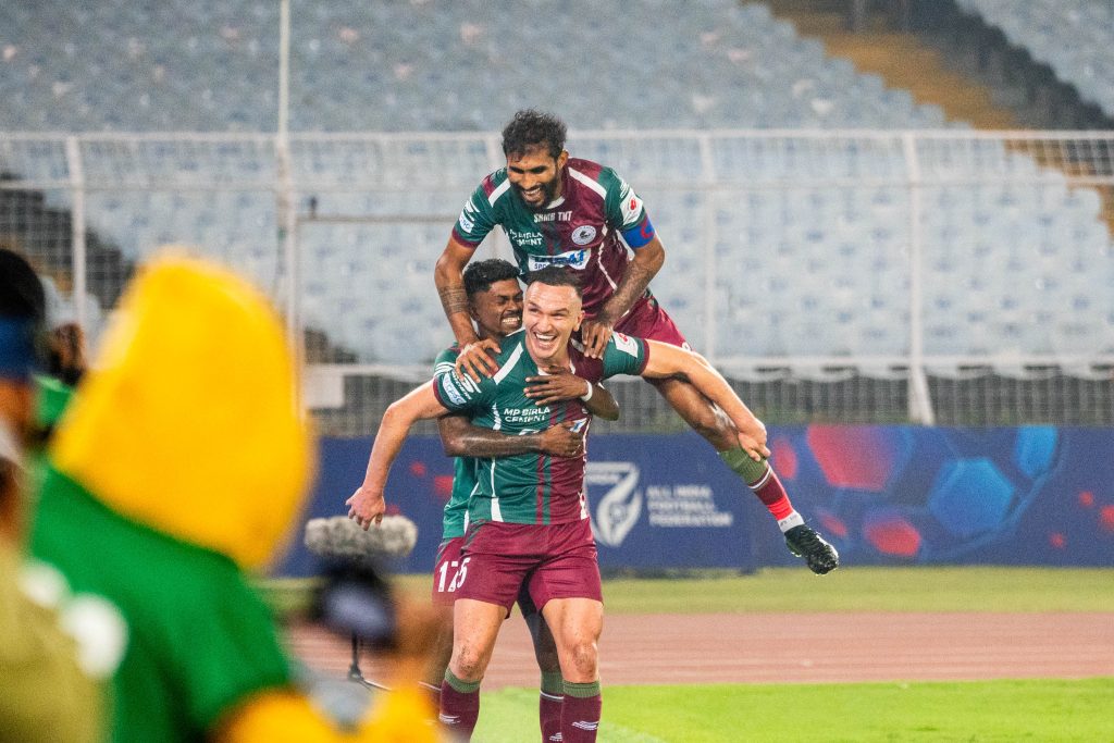 Mohun Bagan SG player Tom Aldred celebrating with teammates after scoring against Hyderabad FC