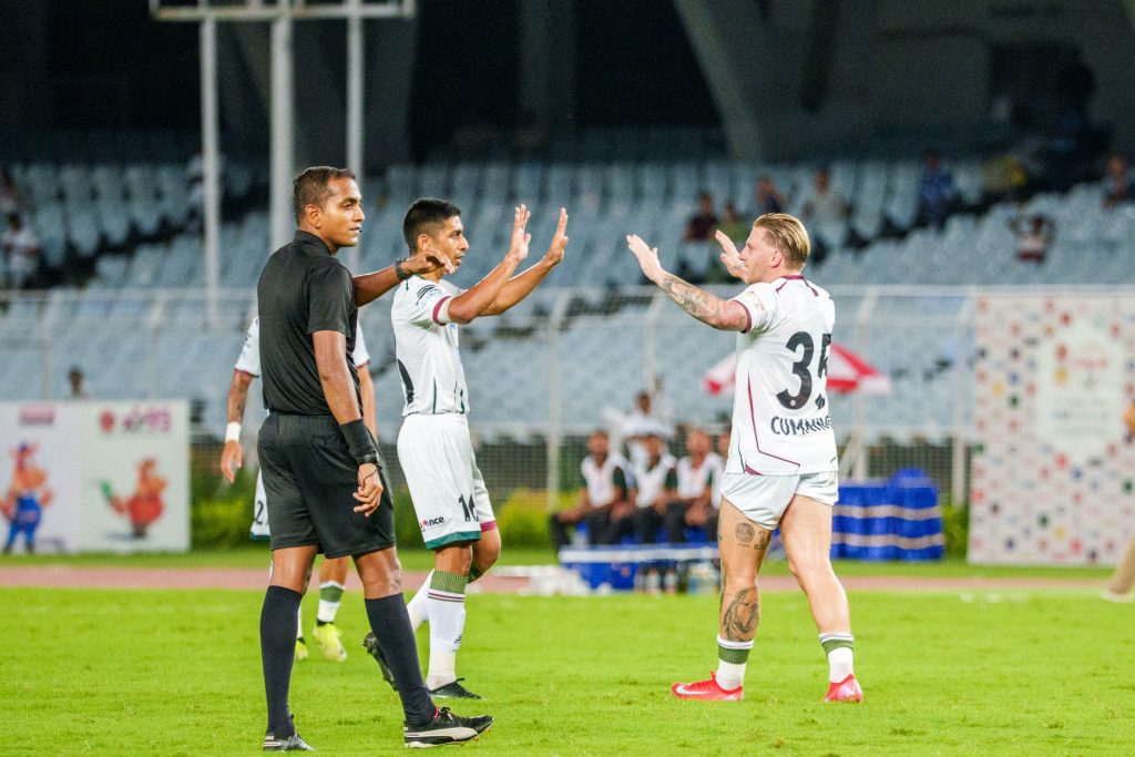 Cummins celebrating after scoring