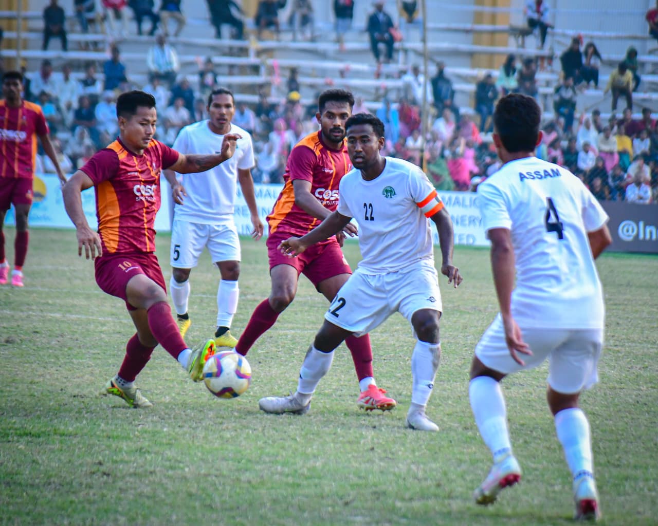 Defending champions West Bengal topped Group A unbeaten after a gritty 1–1 draw with Assam, showing defensive strength in Santosh Trophy 2026.