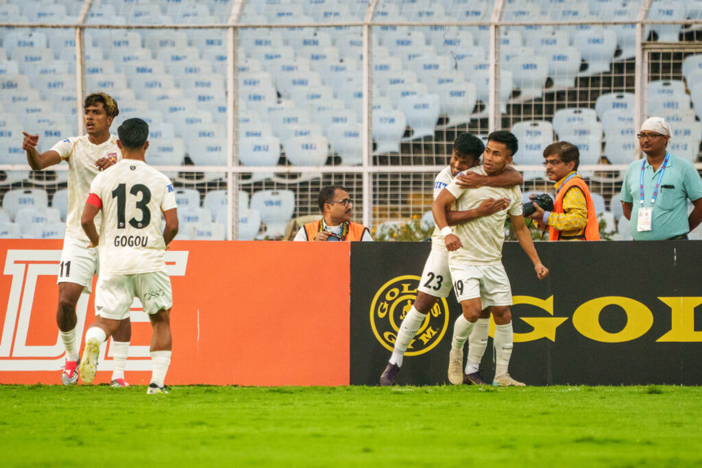 Augustine of SC Delhi celebrating his goal with teammates