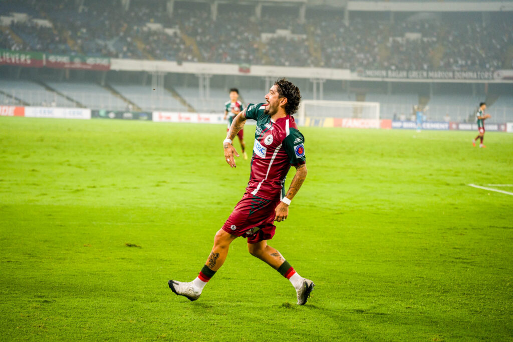 Dimitrios Petratos celebrating goal in his signature style