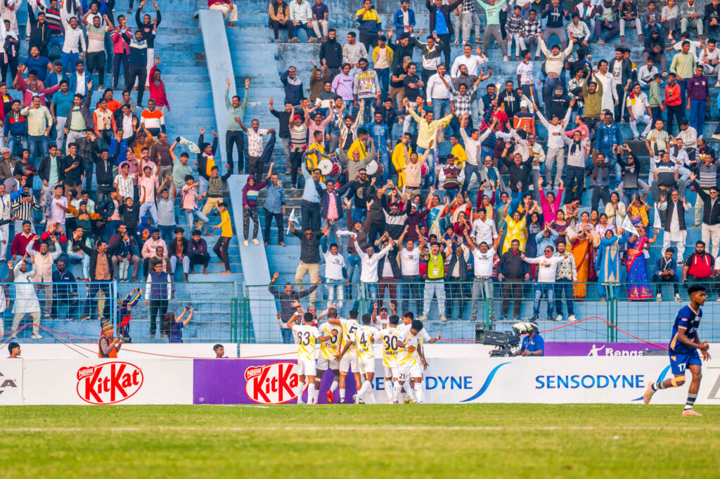 Howrah Hooghly Warriors players celebrating the goal of Sheila Toure in front of fans