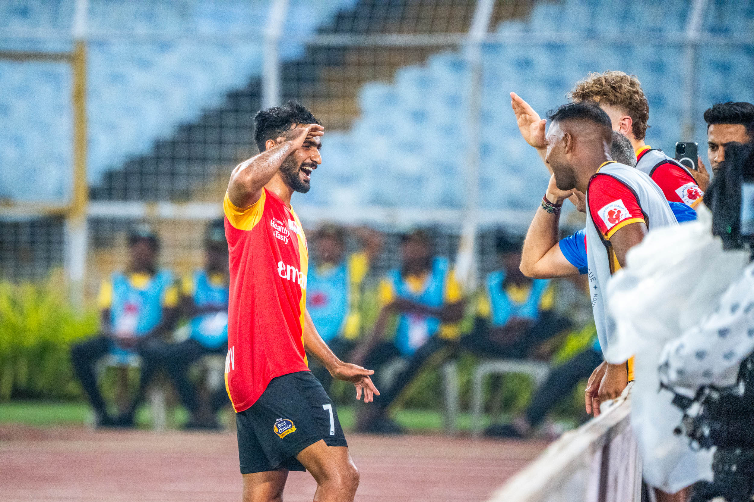 P V Vishnu celebrating with his East Bengal teammates after scoring
