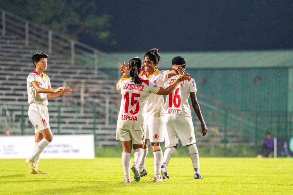Karthika of East Bengal celebrating with teammates her long ranger goal
